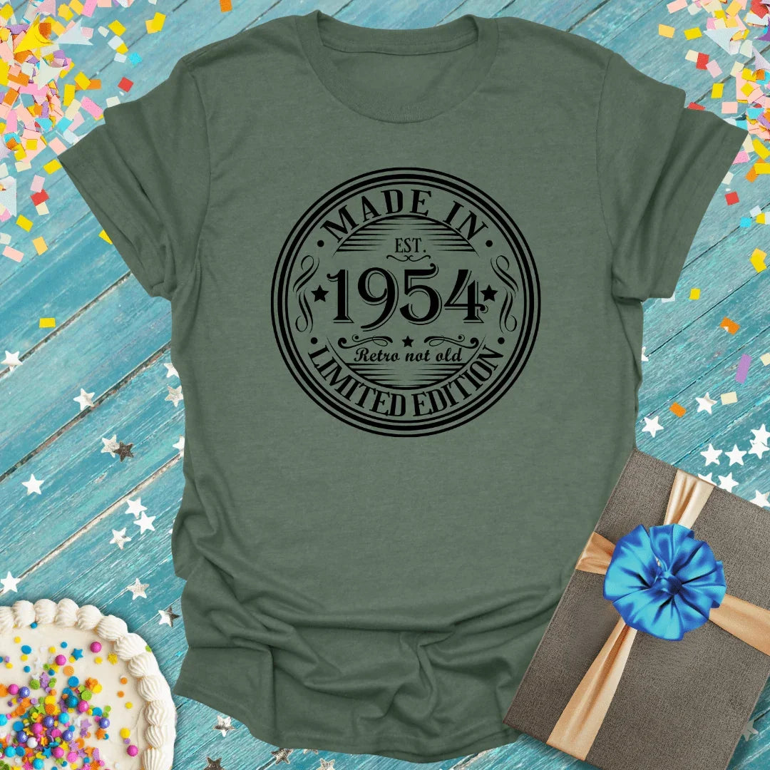 Olive green 'Made in 1954' retro birthday tee with confetti, cake, and gift—perfect for milestone celebrations.