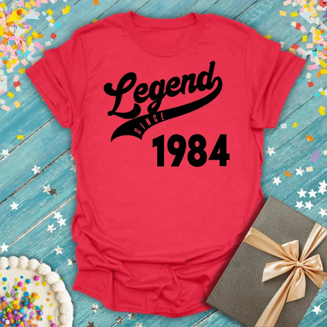 Red 'Legend Since 1984' birthday tee with cake, gift, and confetti — perfect for milestone celebrations