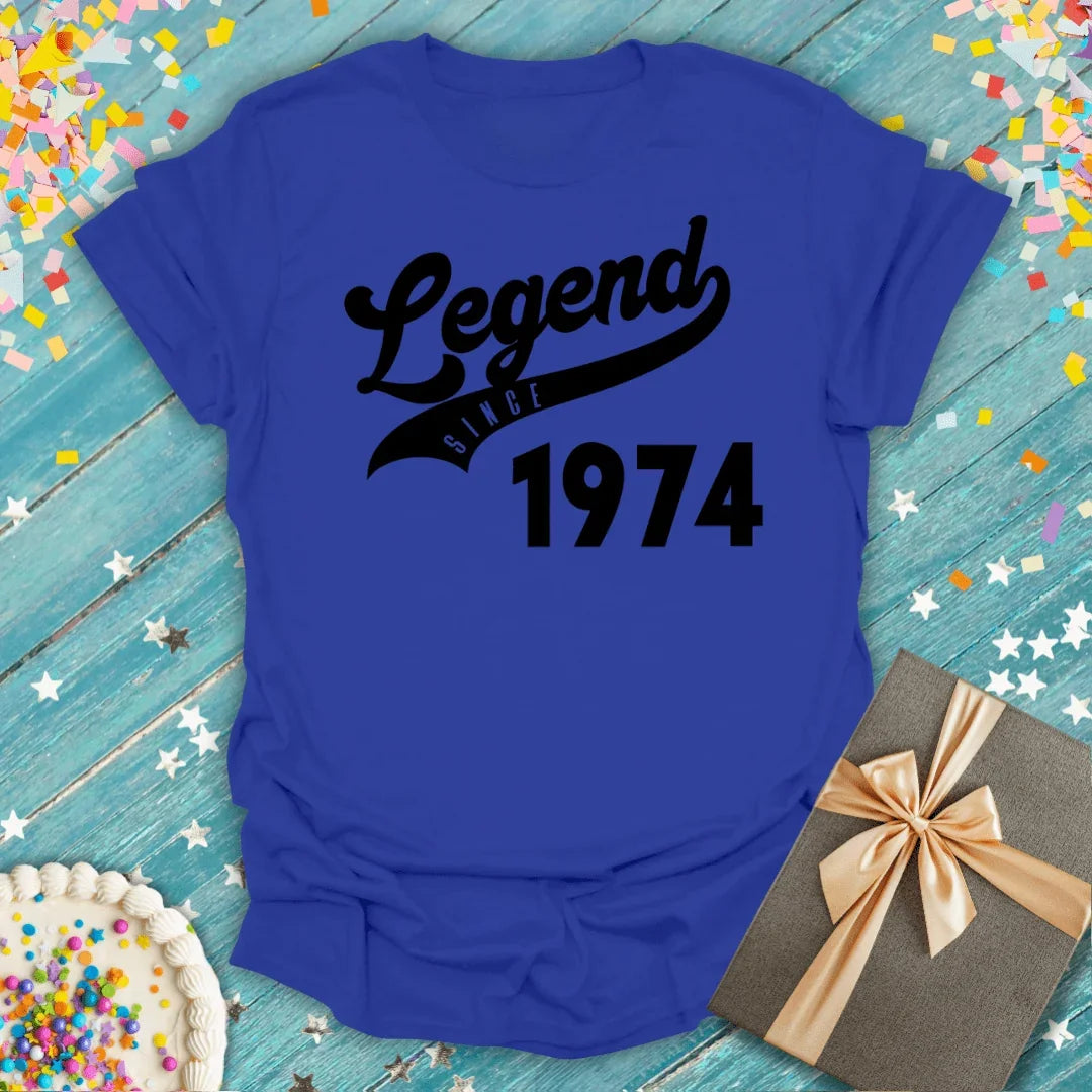 Blue 'Legend Since 1974' birthday tee with confetti, cake, and gift—perfect for milestone celebrations.