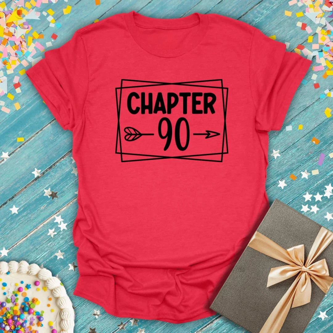 Red 'Chapter 90' birthday tee with confetti, cake, and gift—perfect for 90th birthday celebrations