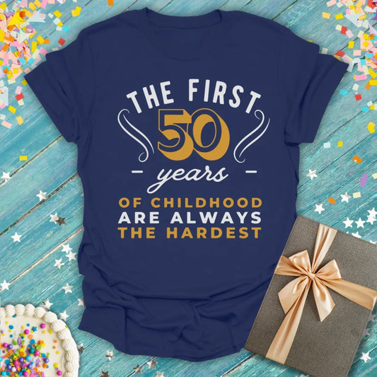 Epic Era Tees navy blue t-shirt featuring 'The First 50 Years of Childhood Are Always the Hardest' text.
