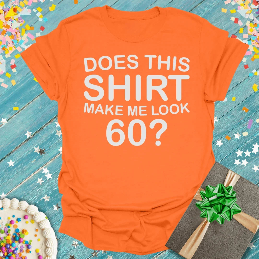 Orange birthday tee asking 'Does this shirt make me look 60?' with cake, gift, and confetti