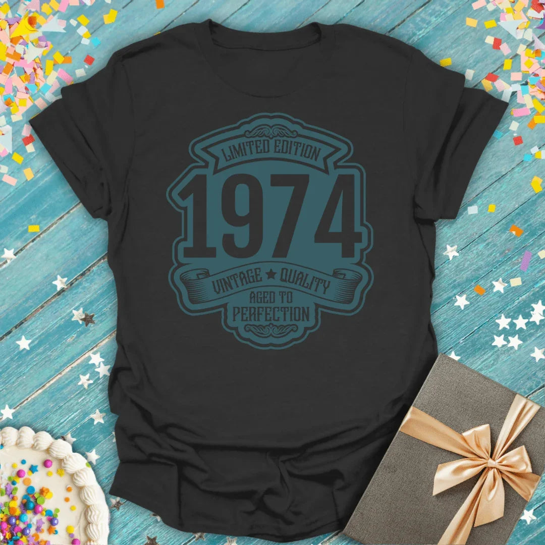 Black 1974 vintage birthday tee with 'Limited Edition Aged to Perfection' design, gift box & cake