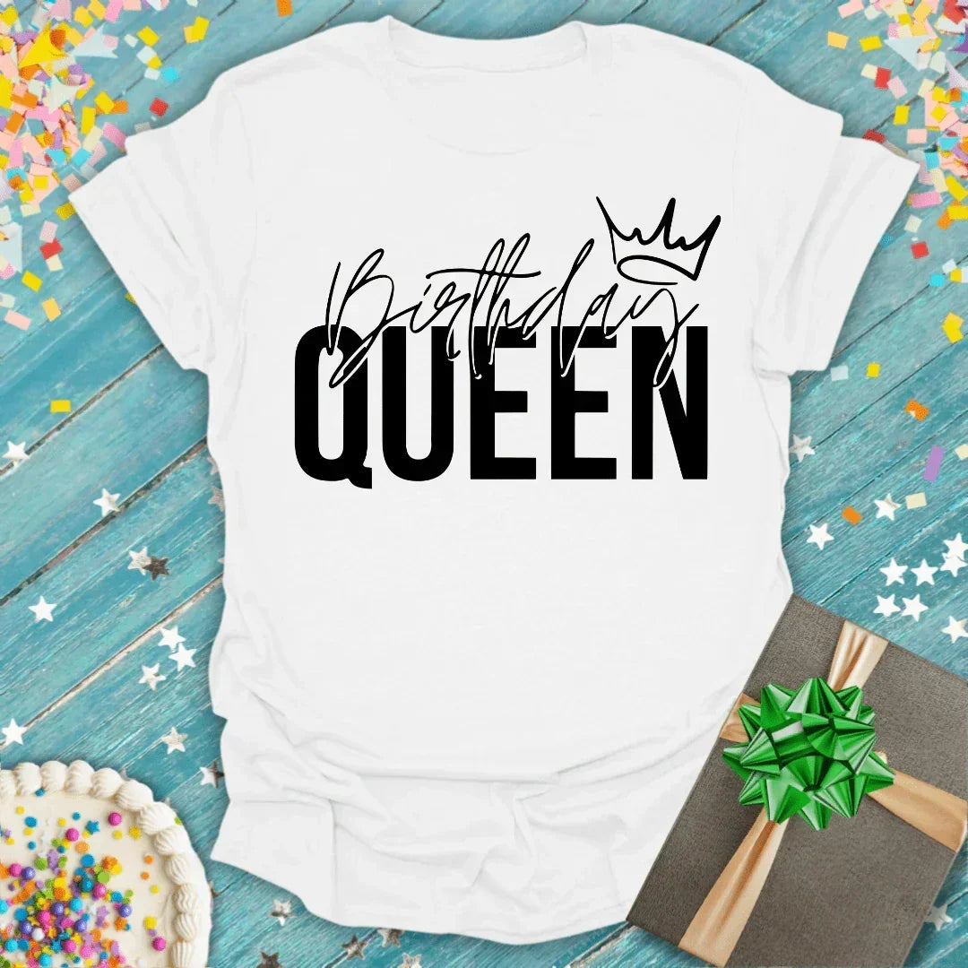 White 'Birthday Queen' tee with crown graphic, surrounded by confetti, cake, and gift — perfect for birthday celebrations.