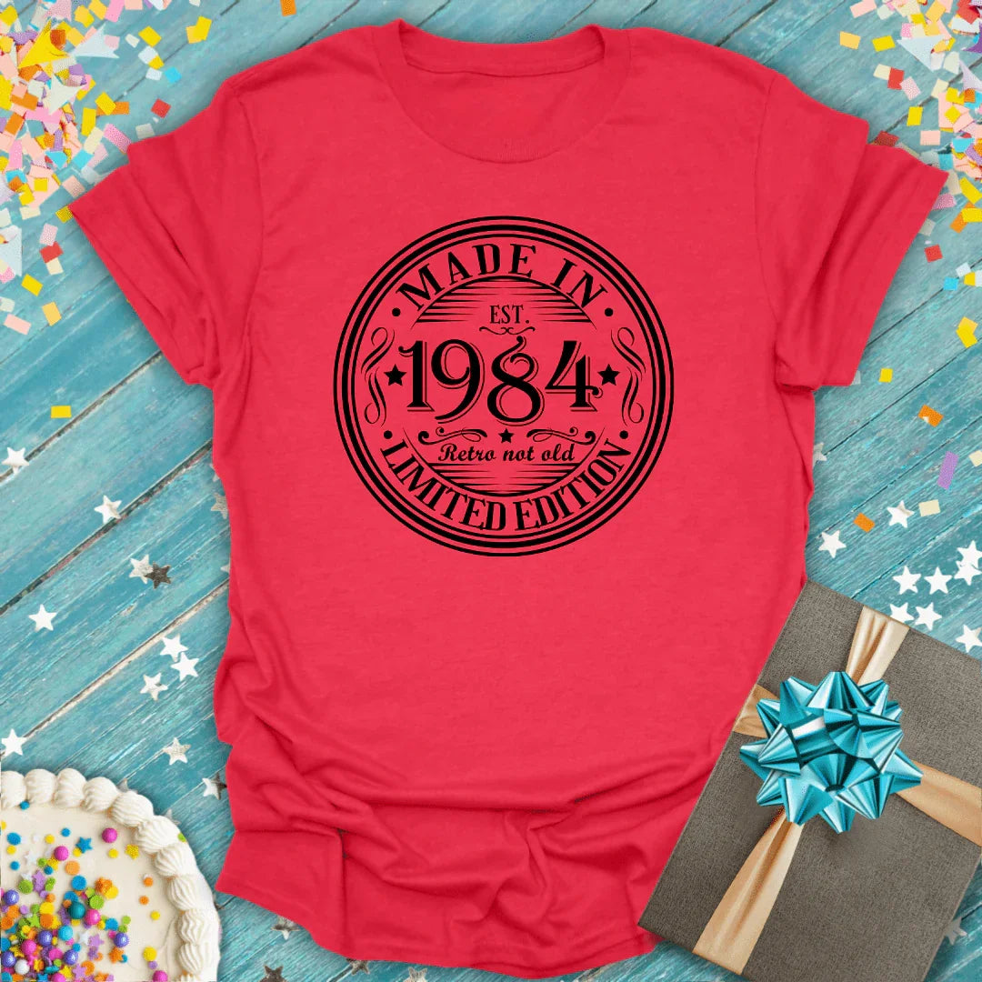 Red 'Made in 1984' retro tee with birthday cake and gift, perfect for milestone celebrations.