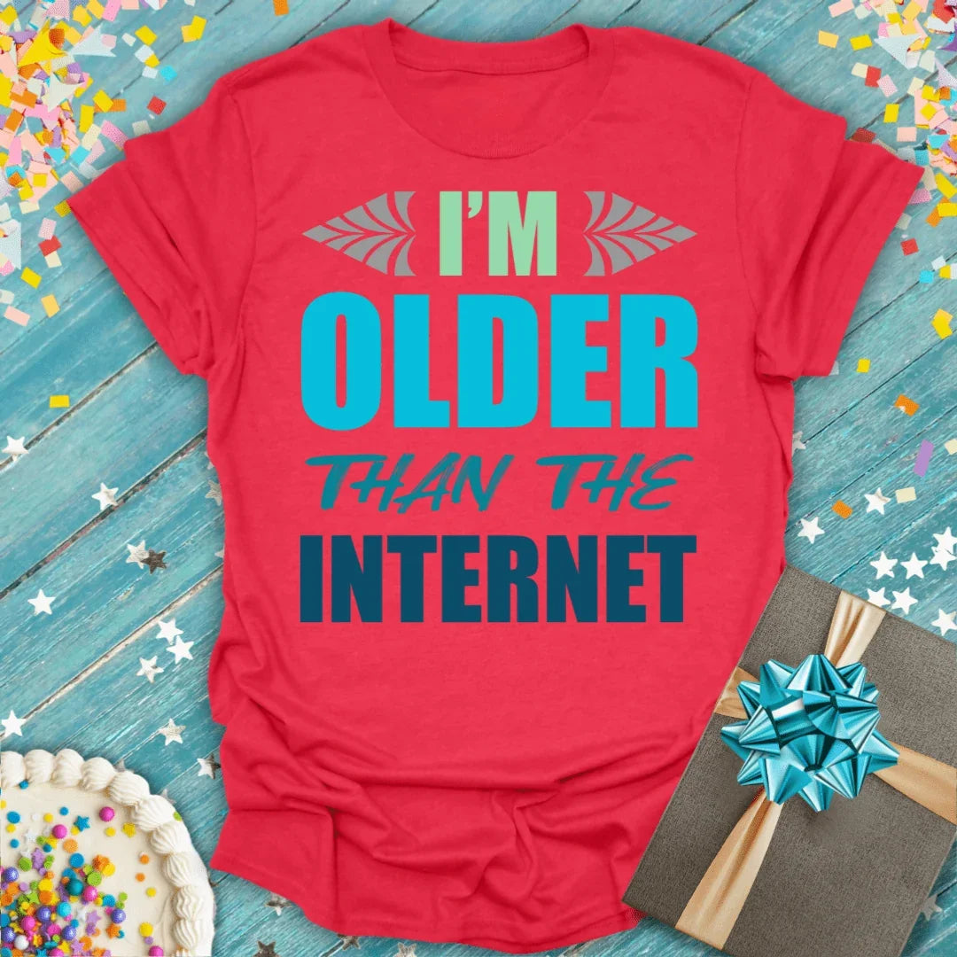 Red 'I'm Older Than The Internet' birthday tee with confetti, cake, and gift—perfect for milestone celebrations.