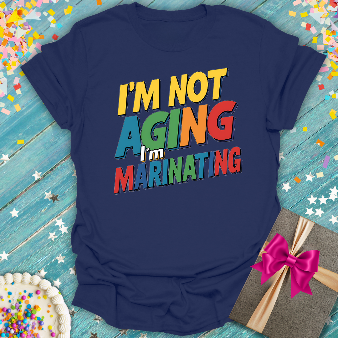 Epic Era Tees navy blue t-shirt with colorful 'I'm Not Aging - I'm Marinating' 3D text graphic.