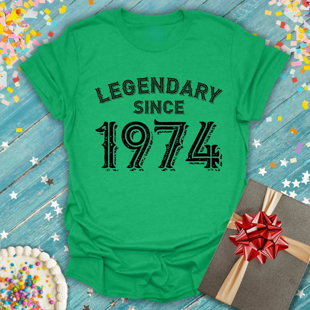 Green 'Legendary Since 1974' birthday tee with cake, gift, and confetti for milestone celebrations