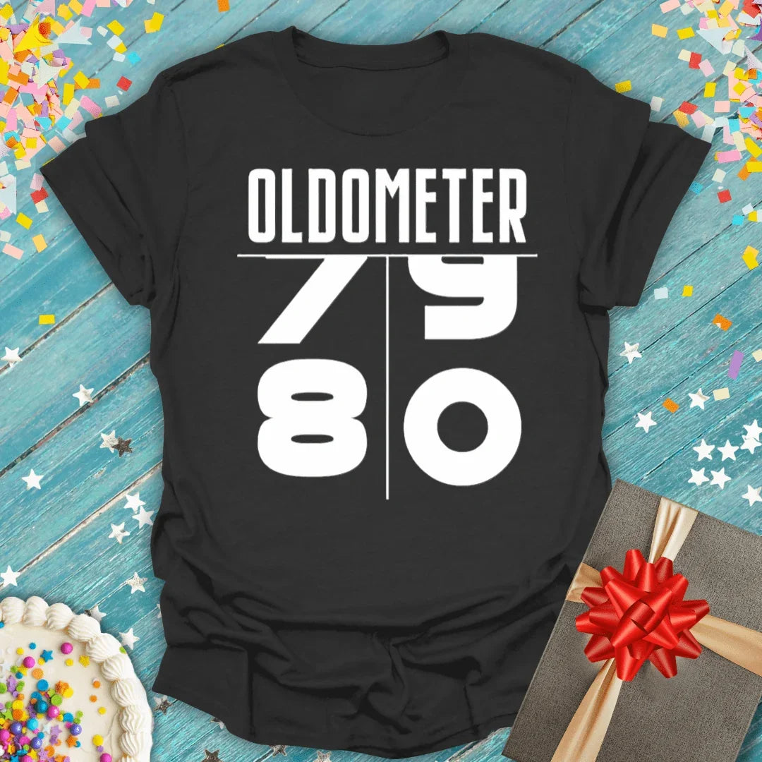 Black Oldometer 79 to 80 birthday tee with confetti, cake, and gift—perfect for milestone celebrations.