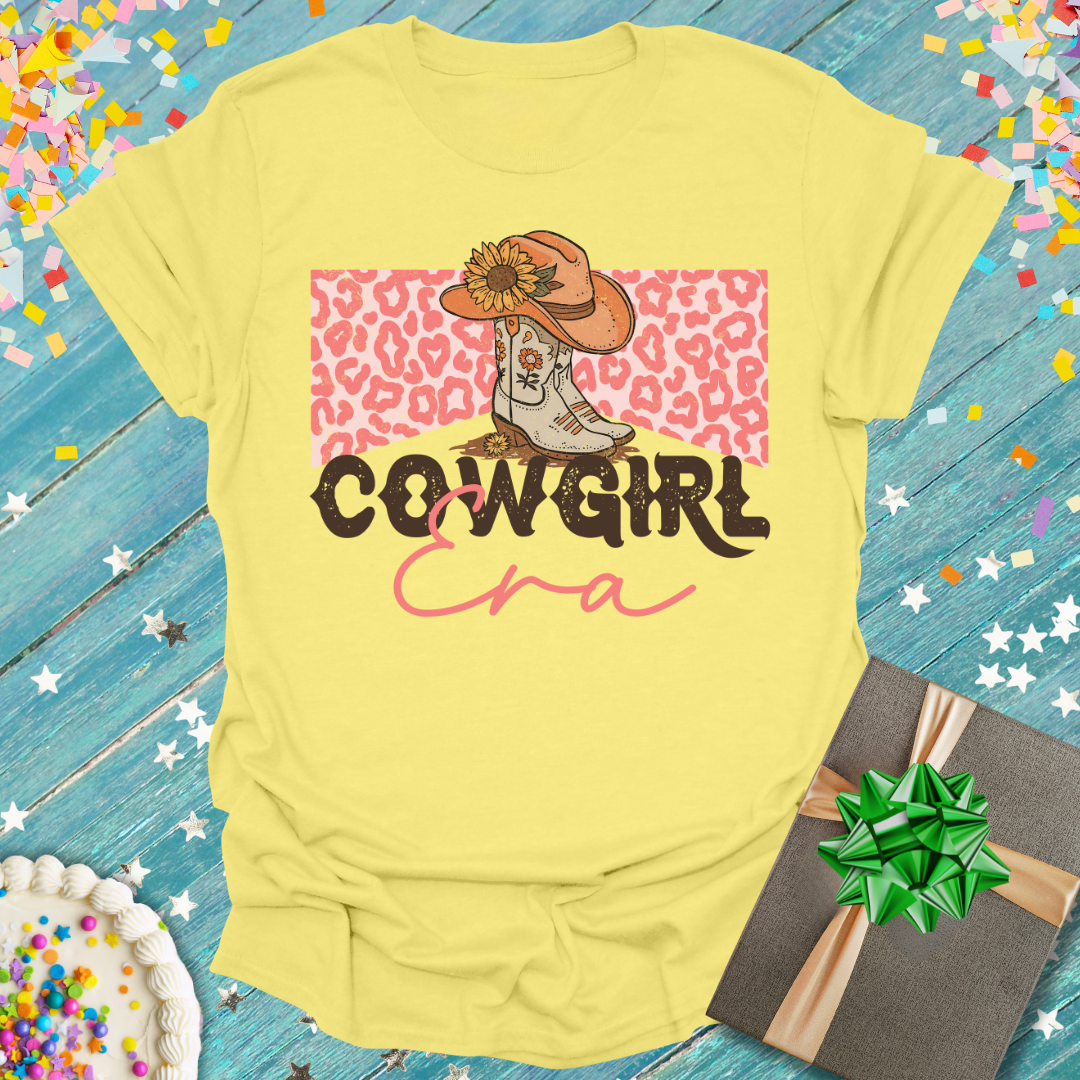 Yellow Epic Era Tees Cowgirl ERA T-Shirt featuring a cowgirl boot, hat, and leopard print design.