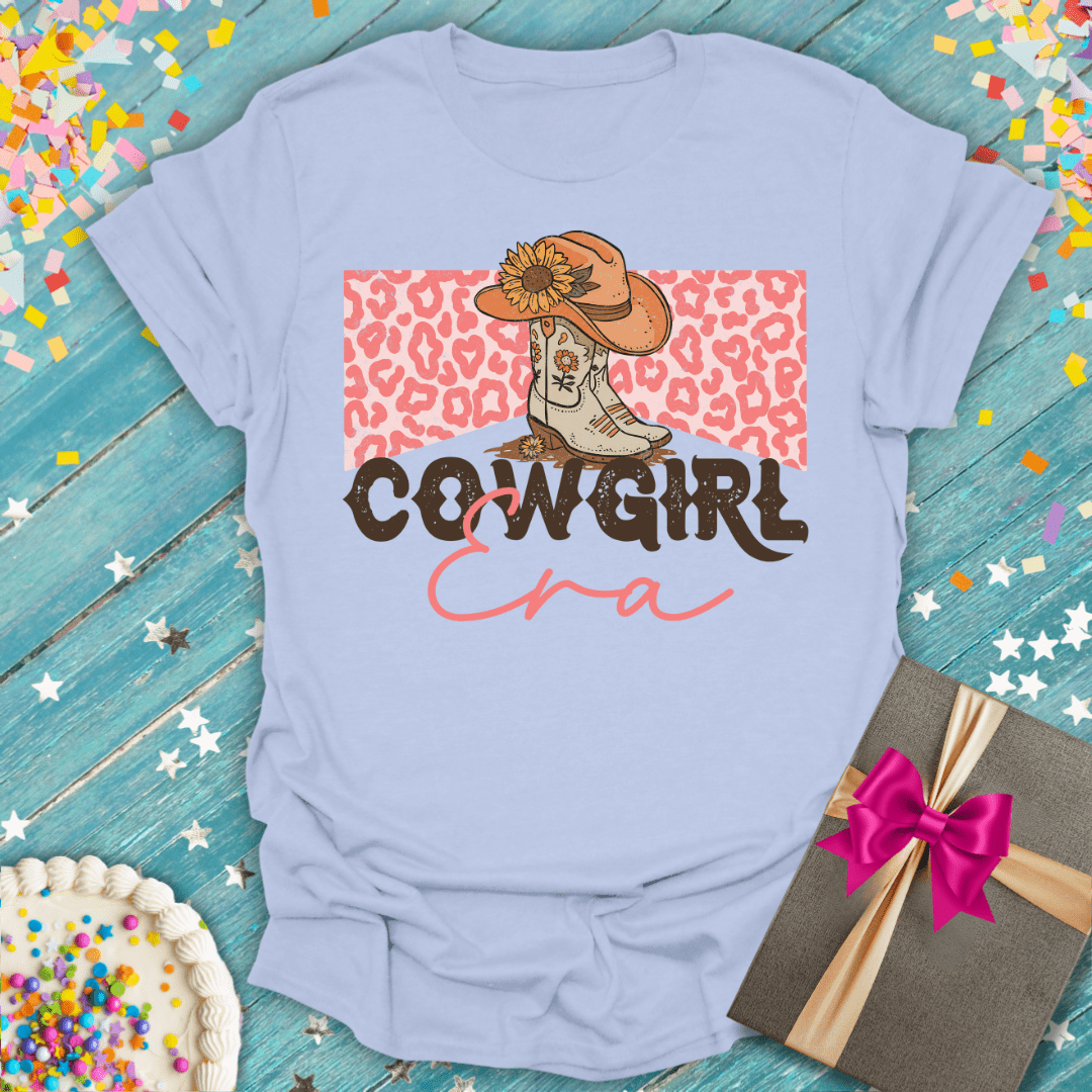 Cowgirl Era tee with cowboy boots, sunflower hat, and leopard printโperfect for birthdays or trips.