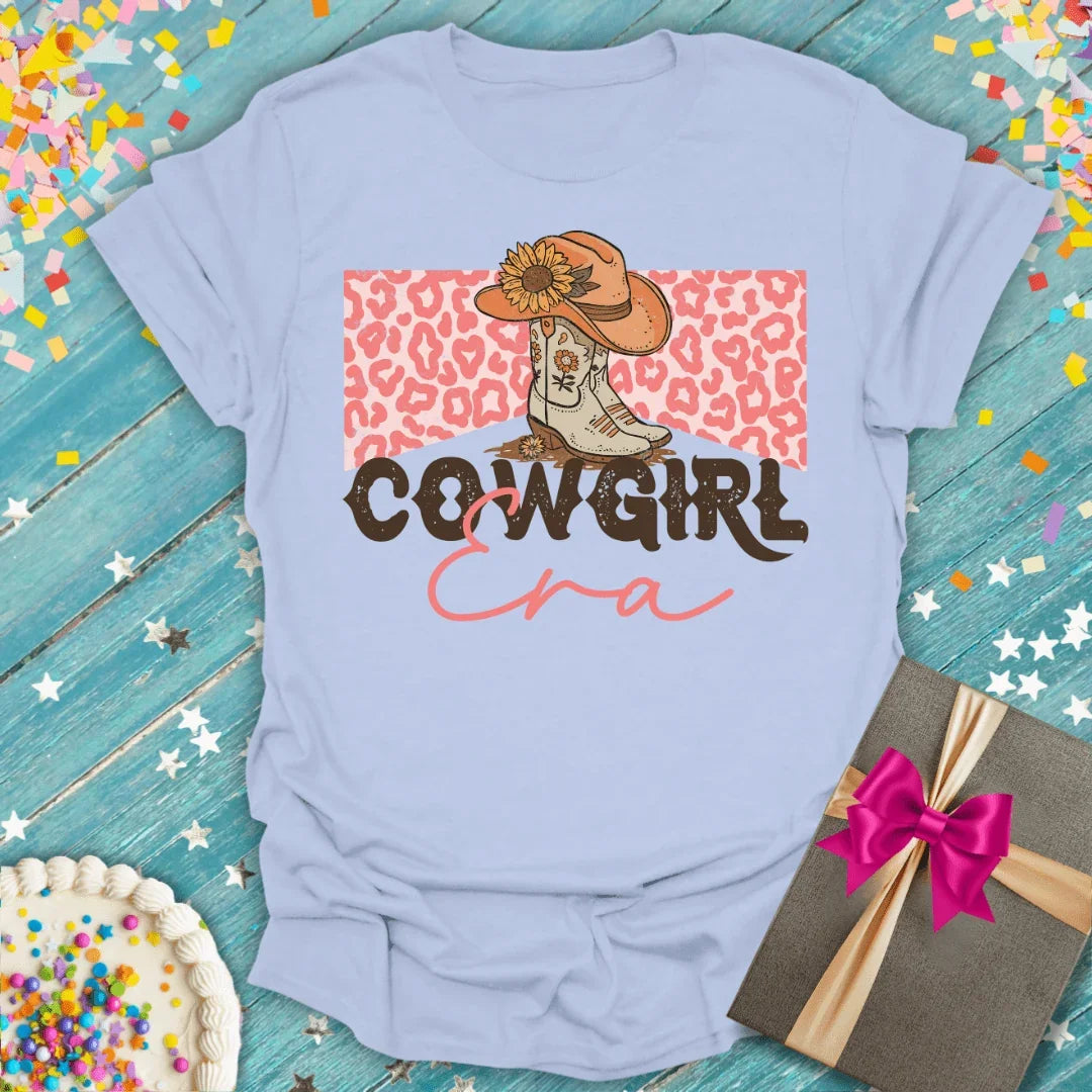 Cowgirl Era tee with cowboy boots, sunflower hat, and leopard print—perfect for birthdays or trips.