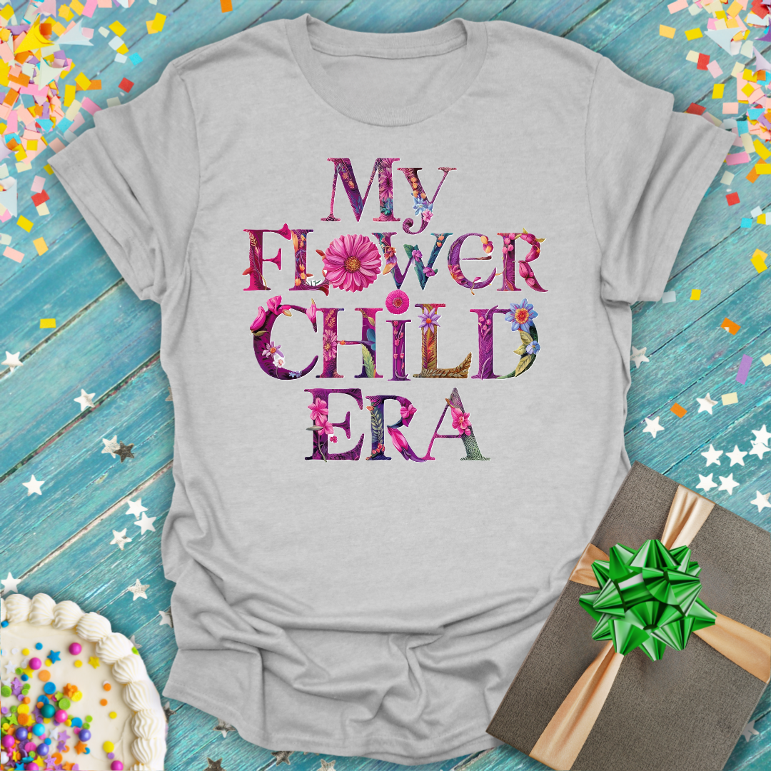 Grey Epic Era Tees t-shirt featuring 'My Flower Child ERA' text filled with colorful floral patterns.