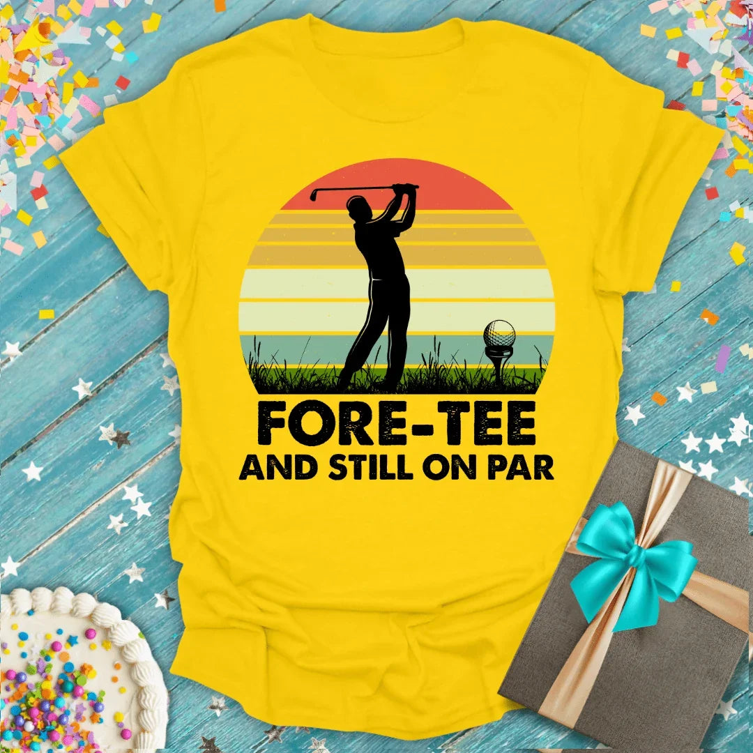 Yellow golf tee shirt with 'Fore-Tee and Still On Par' design, gift box & cake, perfect for birthdays