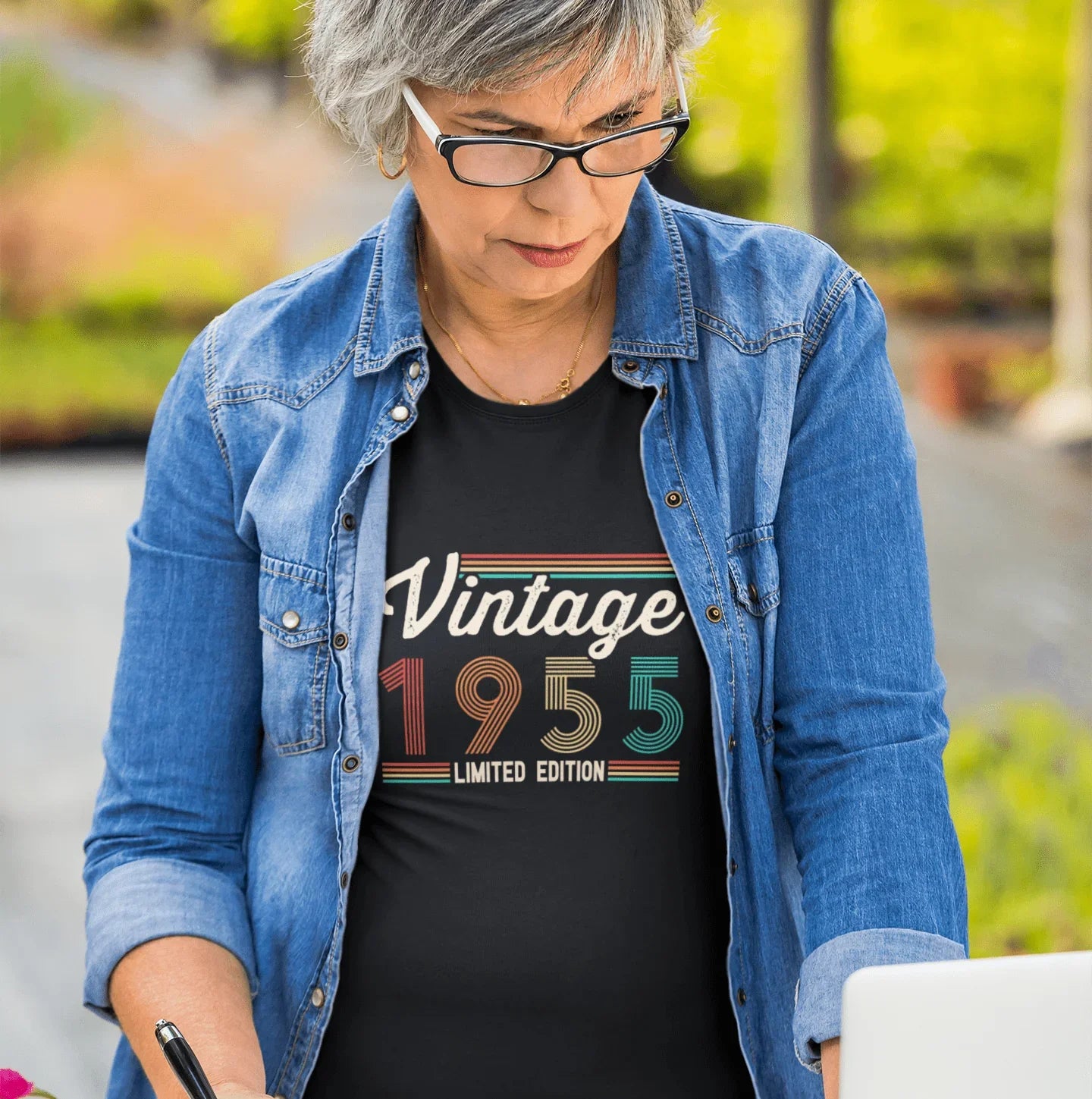 Woman wearing vintage 1955 limited edition t-shirt, perfect for birthday gifts or milestone celebrations.