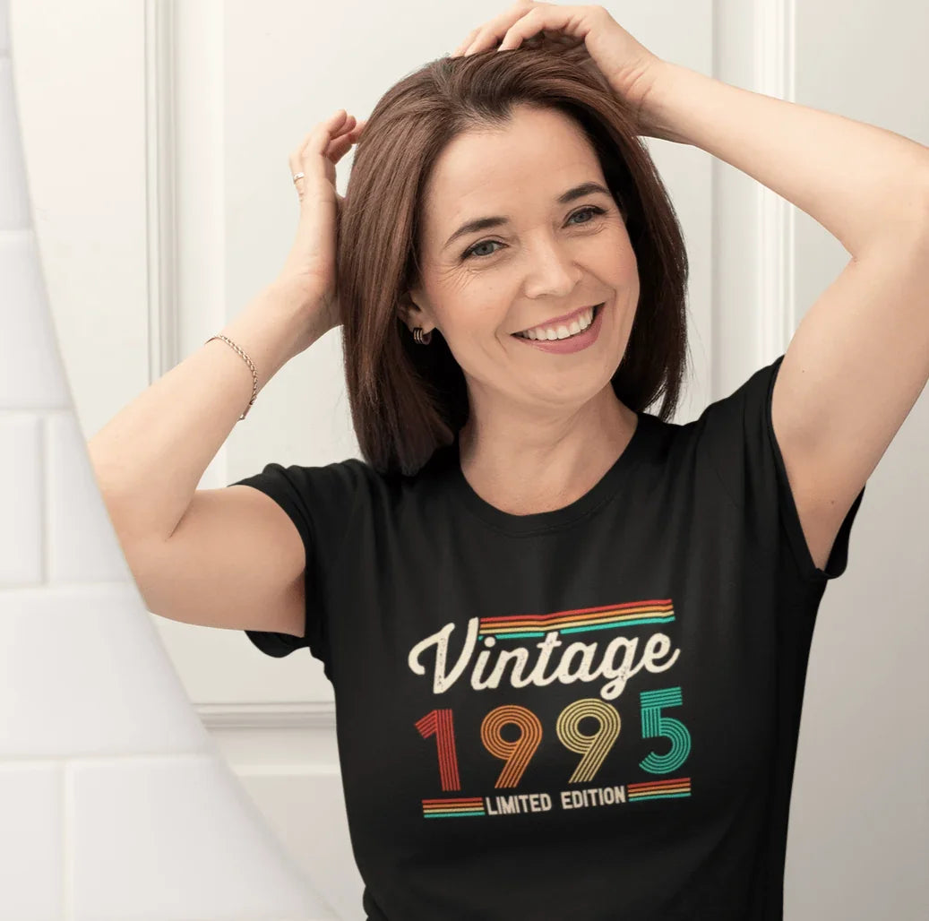 Woman wearing vintage 1995 limited edition retro graphic tee, soft black t-shirt for birthdays or trips