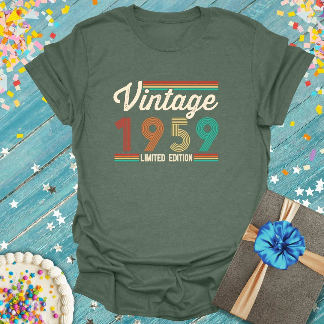 Vintage 1959 limited edition tee with retro design, birthday cake, and gift on blue wood background