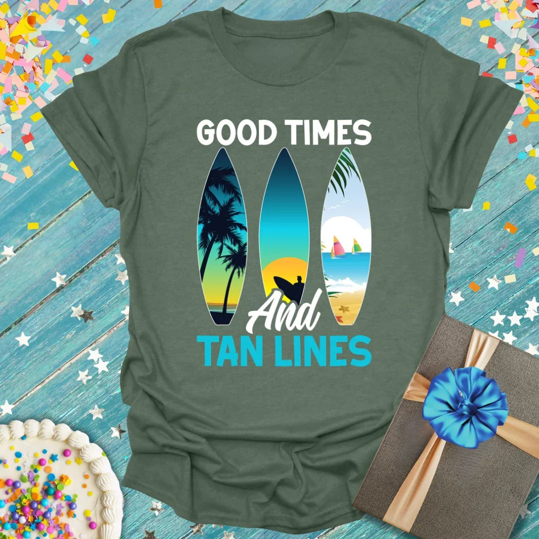 Good Times And Tan Lines t-shirt by Epic Era Tees featuring surfboard graphics with palm trees, sunset, and beach scenes on olive green fabric.