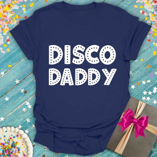 Navy 'Disco Daddy' t-shirt with white dotted lettering, styled with confetti and gift, from Epic Era Tees