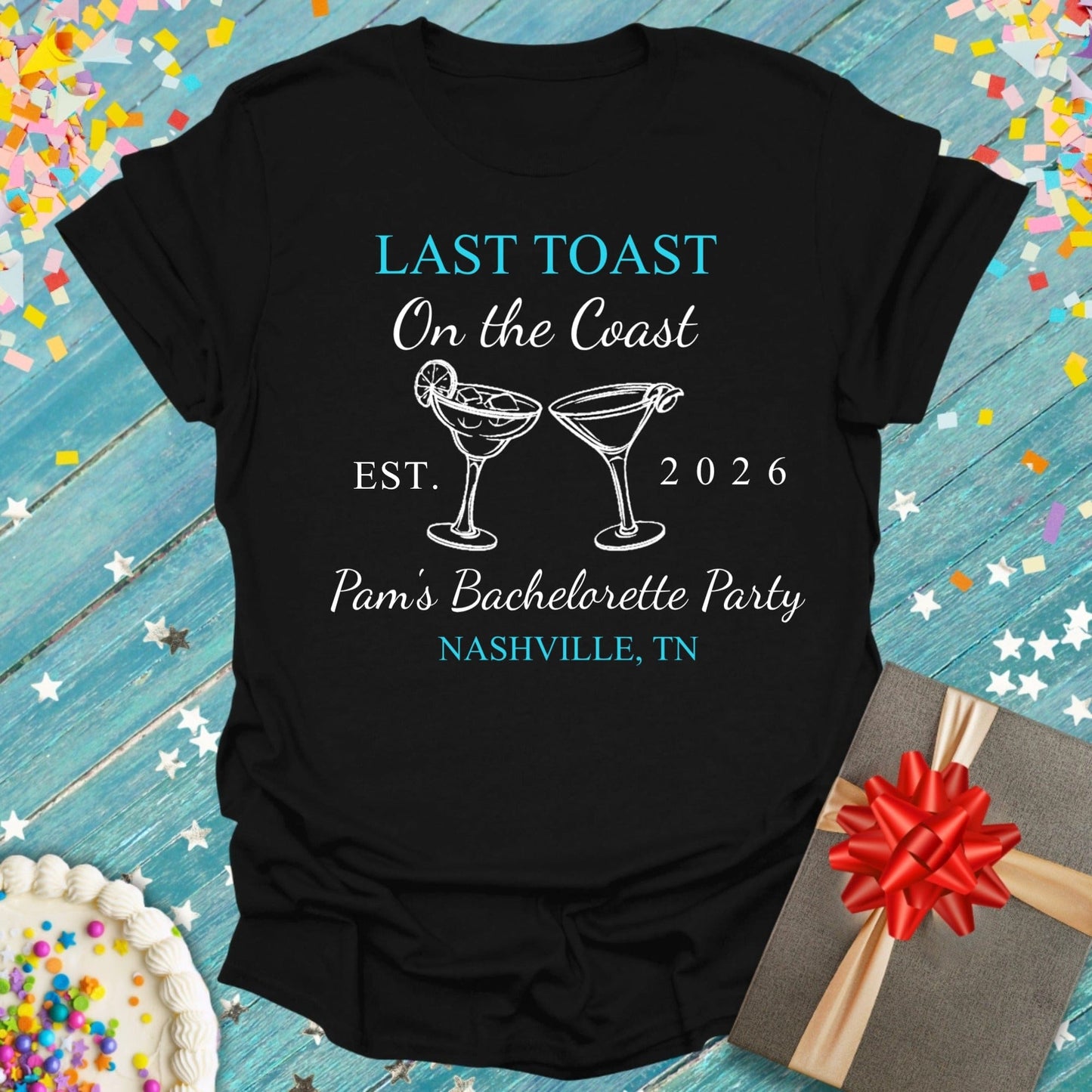 Black t-shirt with 'Last Toast on the Coast' design on a festive background with confetti and a gift.