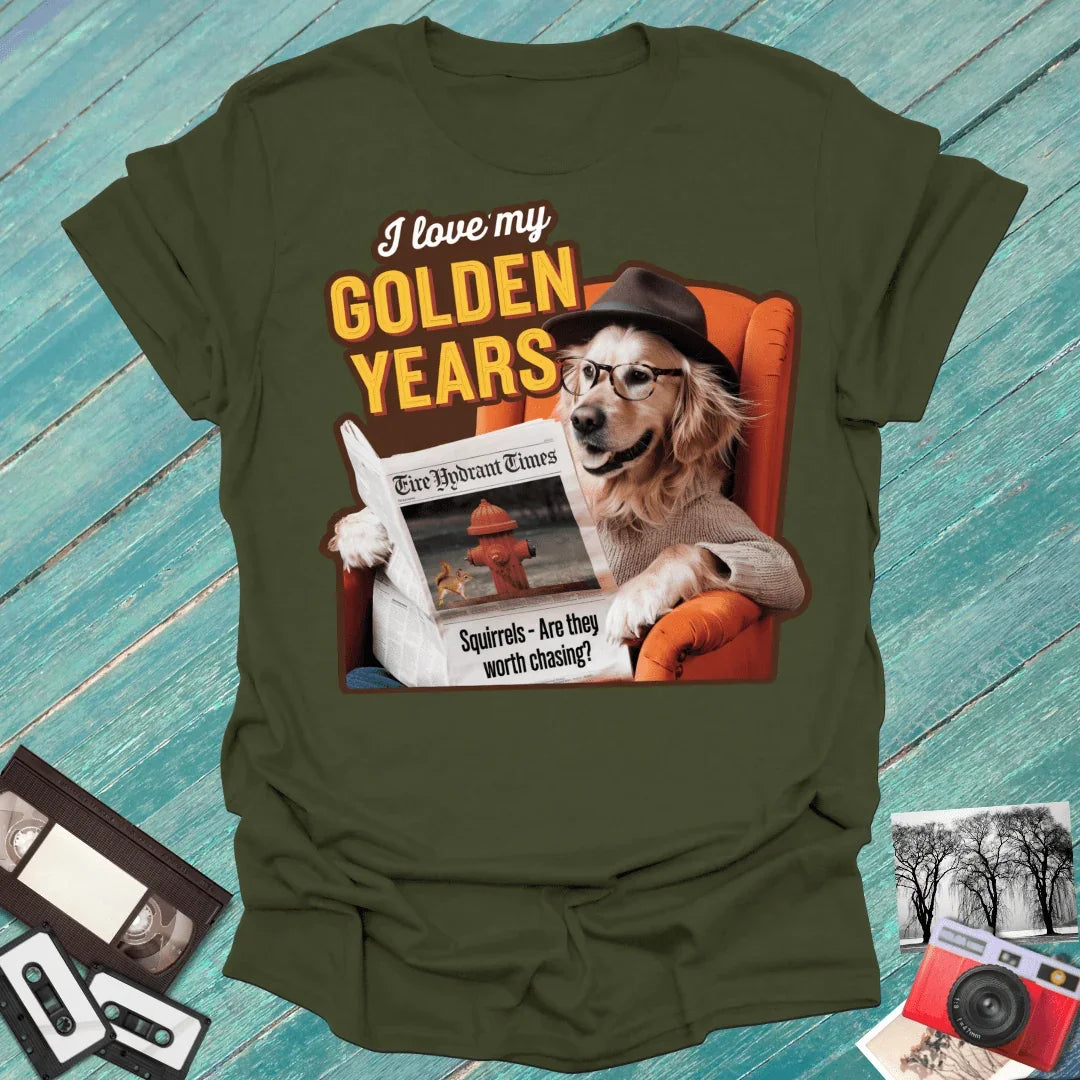 Olive tee with golden retriever in hat reading newspaper, 'I love my GOLDEN YEARS' graphic, retro props