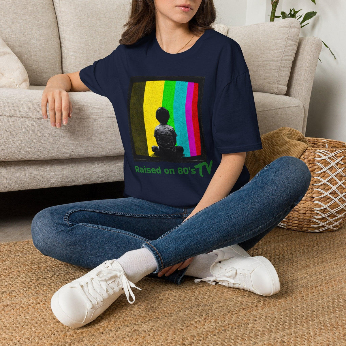 Navy 'Raised on 80's TV' tee by Epic Era Tees featuring retro test pattern graphic with child silhouette.