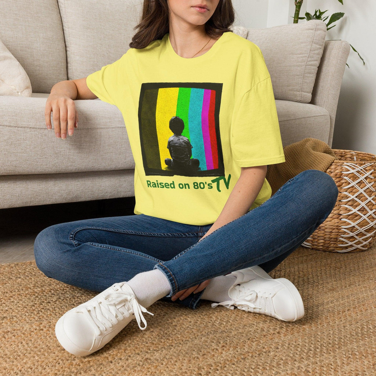 Yellow 'Raised on 80's TV' tee by Epic Era Tees featuring retro test pattern graphic with child silhouette.