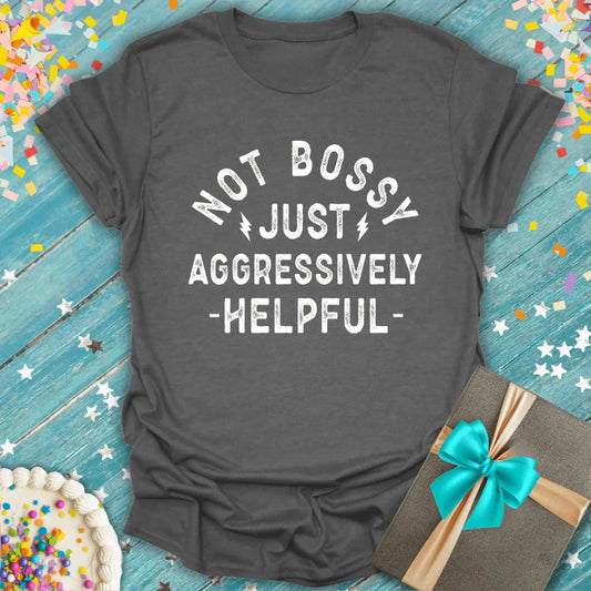 Gray graphic tee with 'Not Bossy Just Aggressively Helpful' surrounded by birthday cake, confetti, and gift box