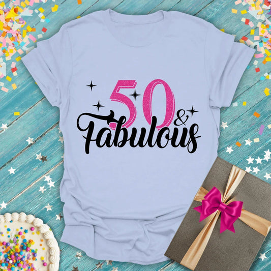 Epic Era Tees light blue shirt with pink glitter '50 & Fabulous' text and stars.