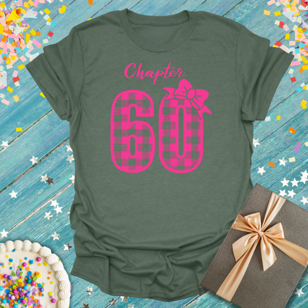 Epic Era Tees olive shirt with 'Chapter 60' in pink buffalo check font by Printify.