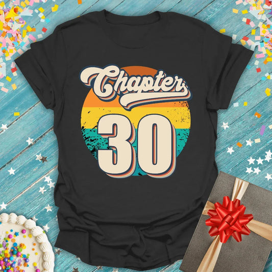Black Epic Era Tees shirt with a retro sunset graphic and 'Chapter 30' in vintage typography.