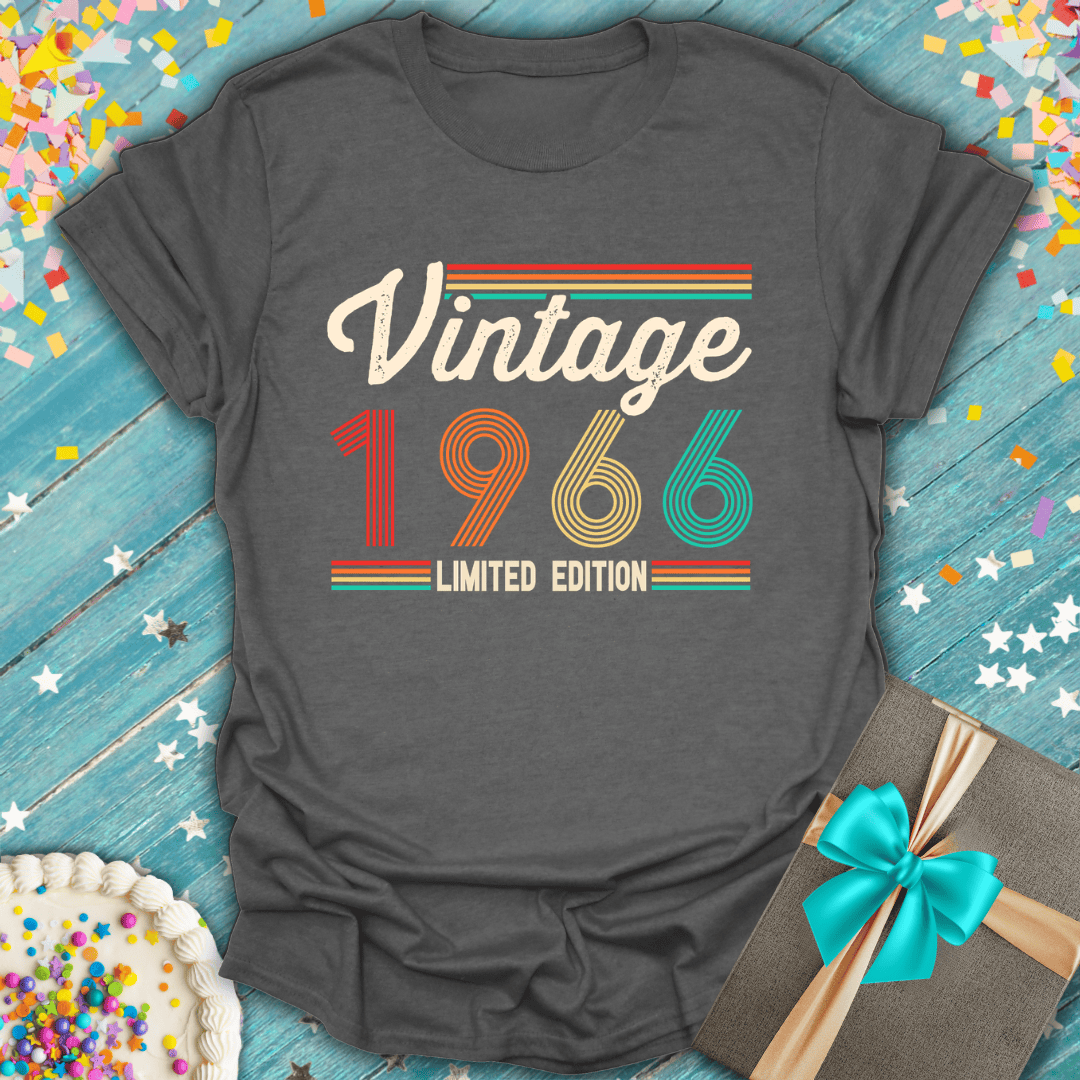 Vintage 1966 limited edition tee on blue wood with cake, gift, confetti — perfect birthday gift