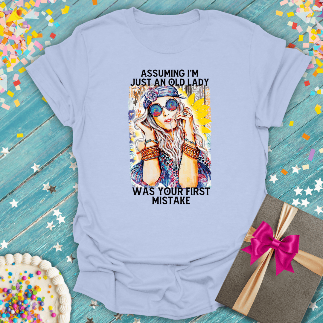 Soft graphic tee with 'Assuming I'm just an old lady was your first mistake' quote, perfect for birthdays or gifts