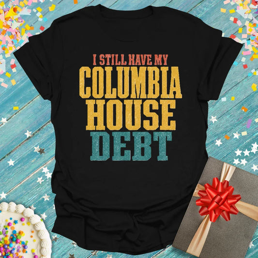 Black t-shirt with vintage-style text 'I STILL HAVE MY COLUMBIA HOUSE DEBT' in orange, gold, and teal. Epic Era Tees.