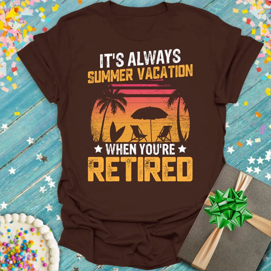Brown t-shirt with 'It's Always Summer Vacation When You're Retired' text and palm tree sunset graphic by Epic Era Tees