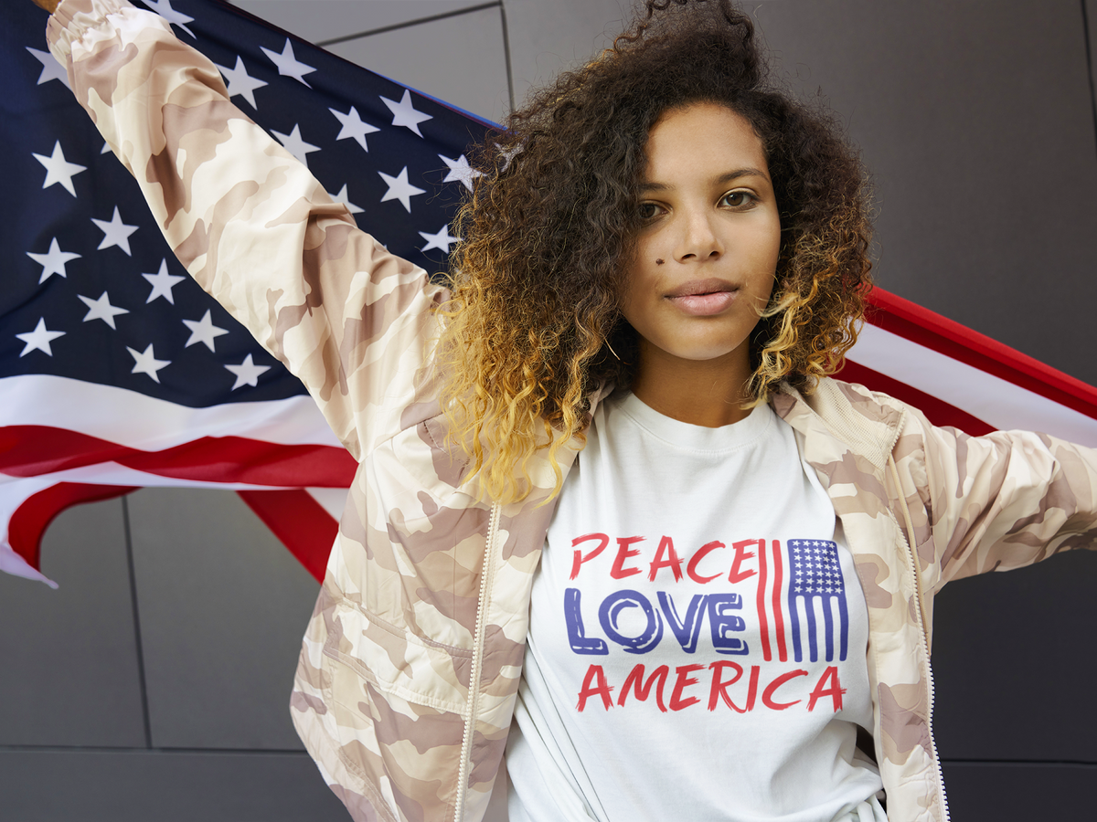 Epic Era Tees white Peace Love America T-Shirt with red and blue text and a small US flag graphic.