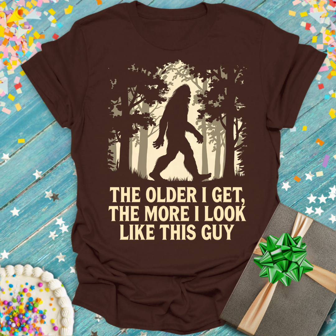 Brown Epic Era Tees shirt featuring a Bigfoot graphic and 'The Older I Get, The More I Look Like This Guy' text.