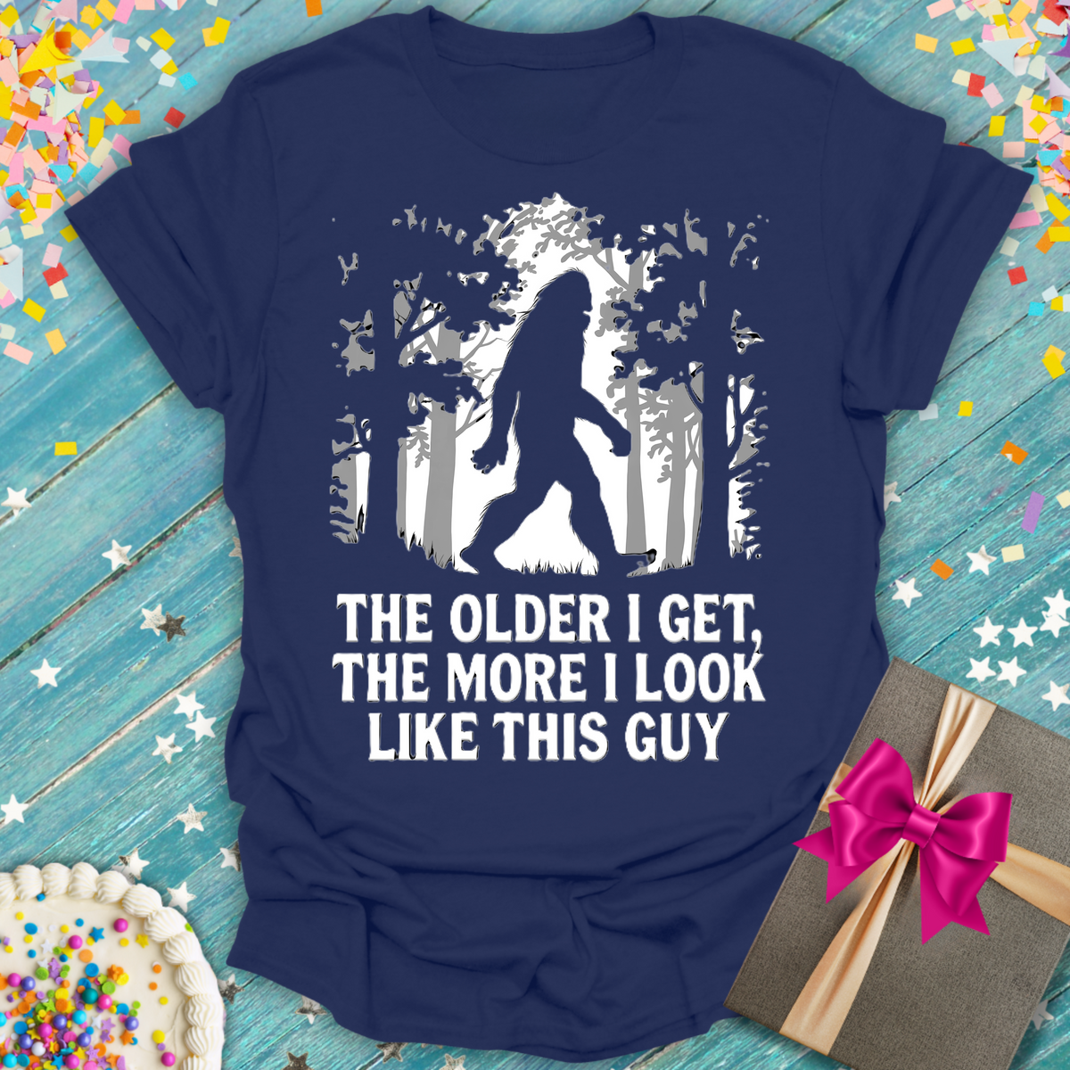 Navy blue Epic Era Tees shirt: 'The Older I Get, The More I Look Like This Guy' with Bigfoot graphic.