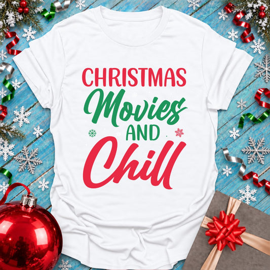 White Epic Era Tees Christmas Movies T-Shirt with red and green text and festive snowflakes.