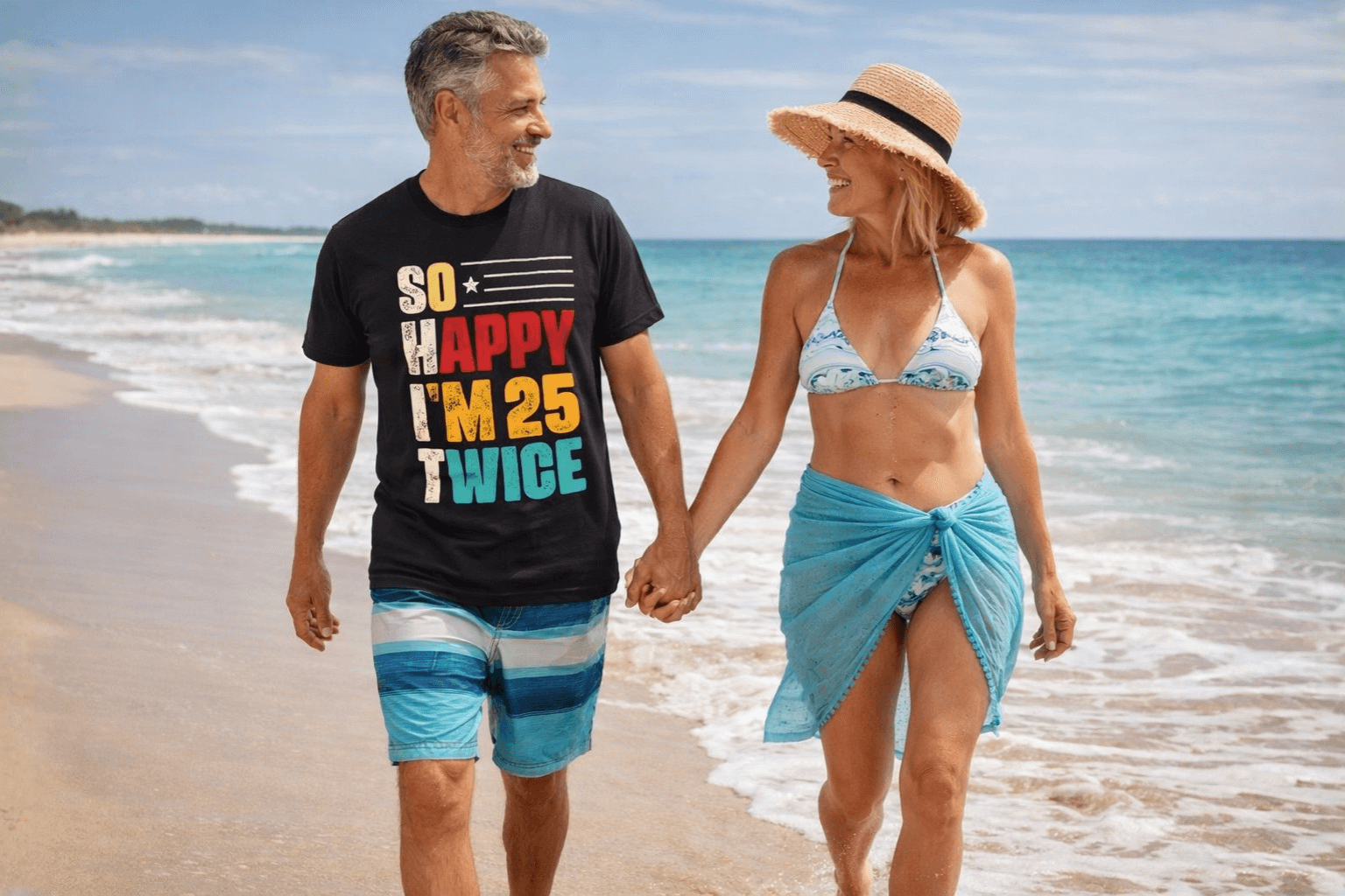 Man in 'So Happy I'm 25 Twice' birthday tee walking beach with woman, soft tees for trips & milestones
