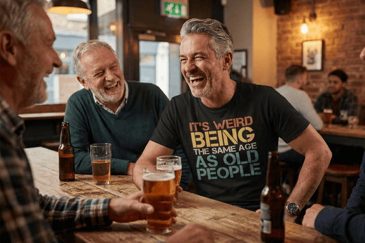 Man laughing in bar wearing funny birthday tee: 'It's weird being the same age as old people'